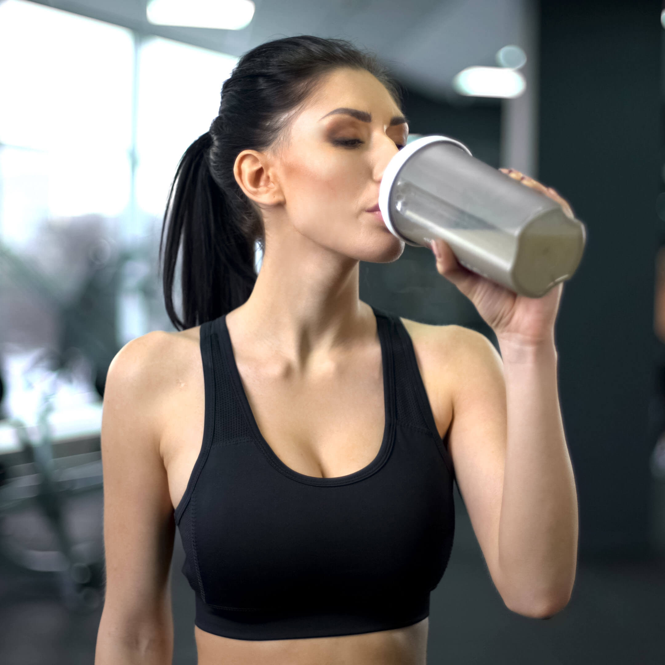 Sporty Woman Drinking Protein Shake After Workout Muscle Gain
