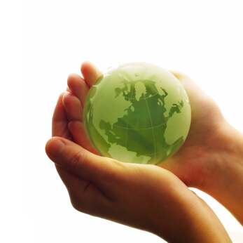 hands holding green earth