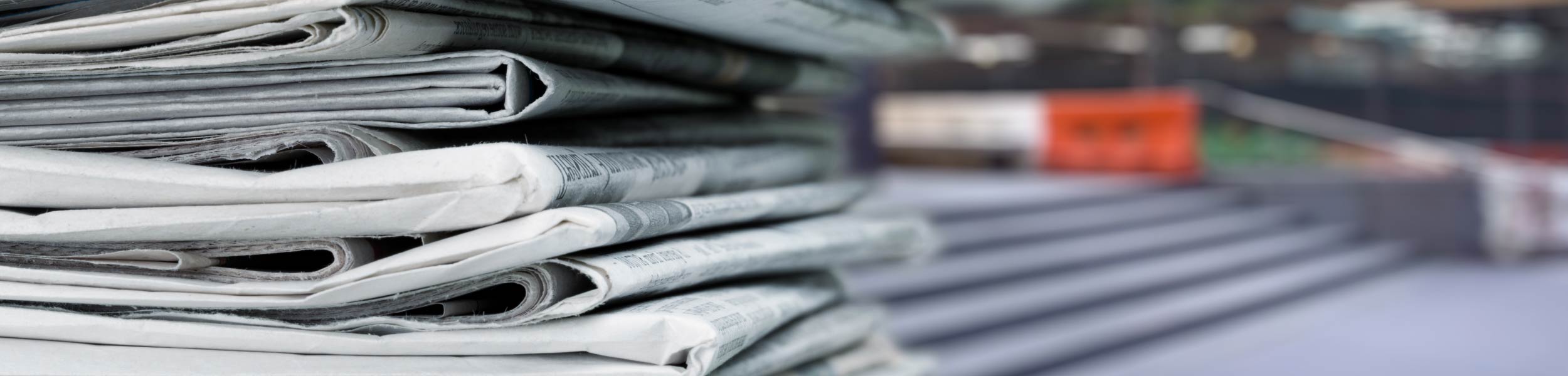 Newspapers stacked